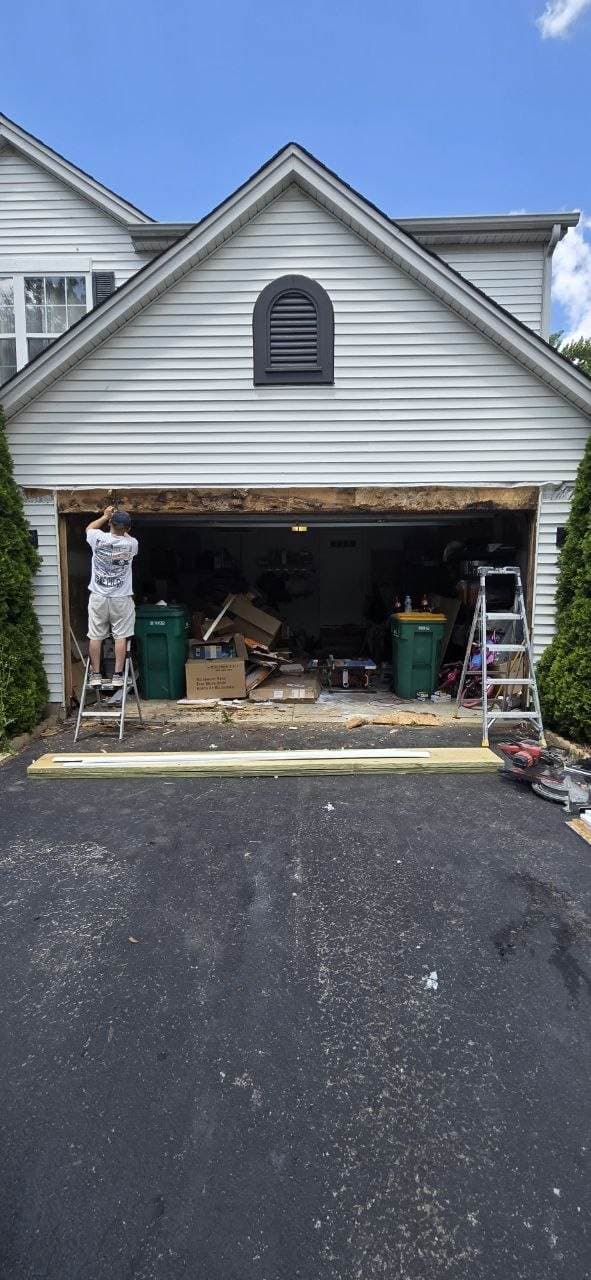 Garage door opening frame repair work in progress by BAX