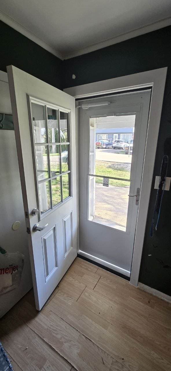 Interior view of entry door and storm door installation completed by BAX
