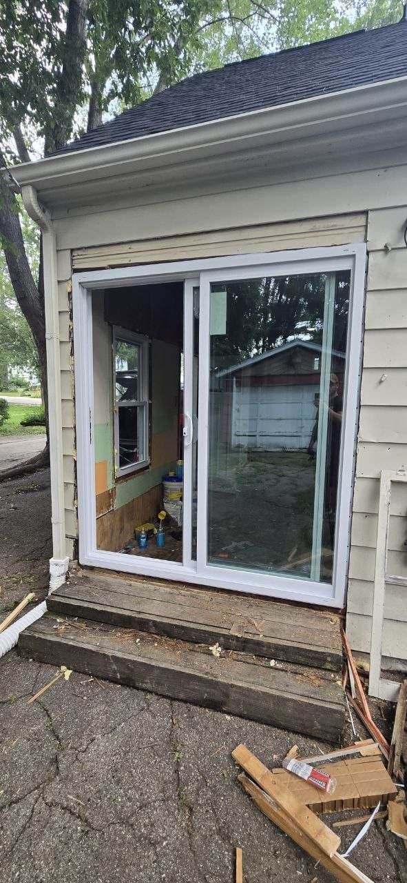 Sliding patio door installation from the exterior with trim prep by BAX