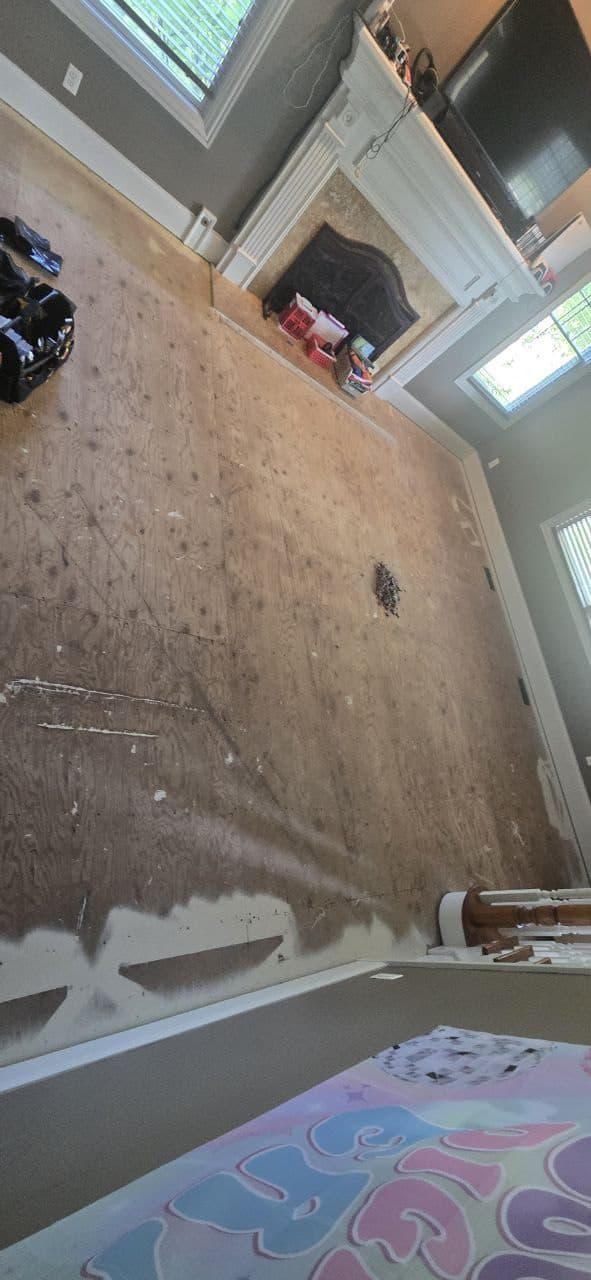 Living room subfloor prepared before laminate flooring installation by BAX
