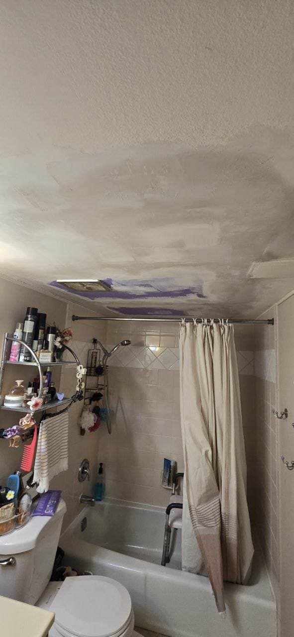 Bathroom ceiling drywall patch progress near Hoffman Estates by BAX Bathroom ceiling drywall patching in progress over a shower area by BAX