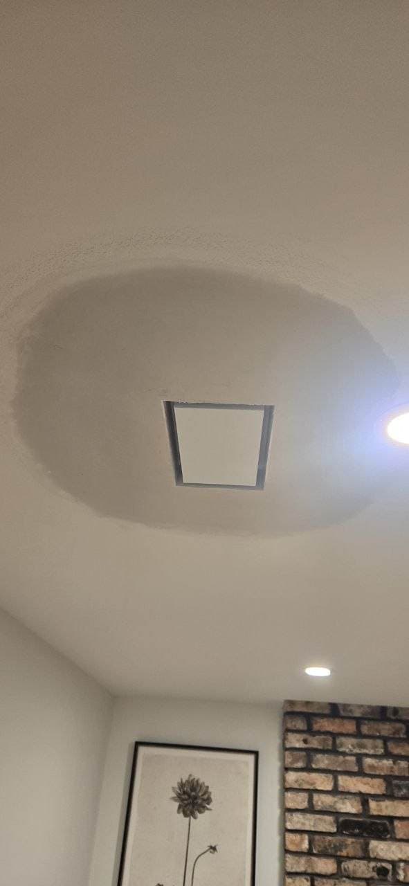 Ceiling drywall patch around access panel by BAX in Hoffman Estates Ceiling drywall patch around an access panel after repair by BAX