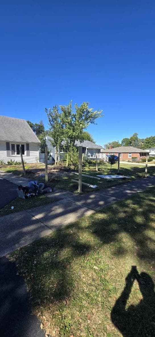 Front yard fence post installation progress near Hoffman Estates by BAX Front yard fence posts installed before vinyl fence panels by BAX
