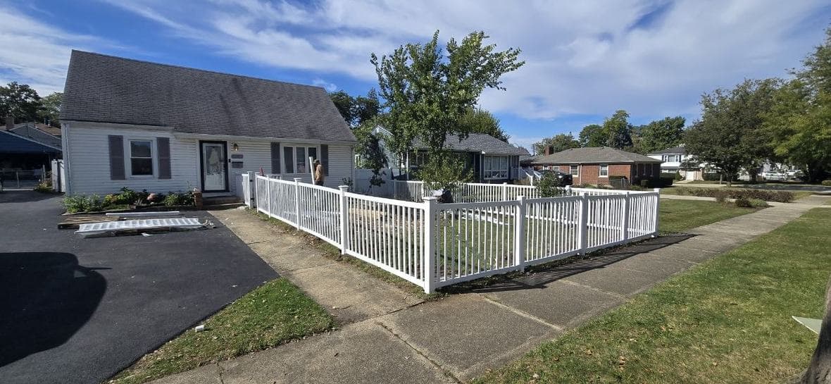 White vinyl front yard fence installation in Hoffman Estates by BAX White vinyl front yard fence installation completed by BAX