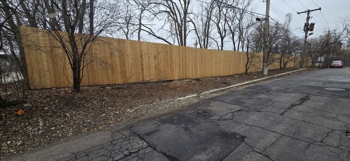 Wood privacy fence installation near Hoffman Estates by BAX Long wood privacy fence installation completed by BAX near Hoffman Estates