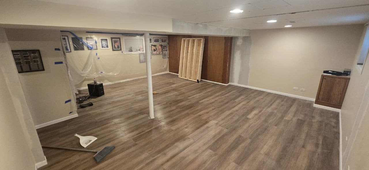 Basement laminate flooring installation near Hoffman Estates by BAX Finished basement laminate plank flooring installation by BAX